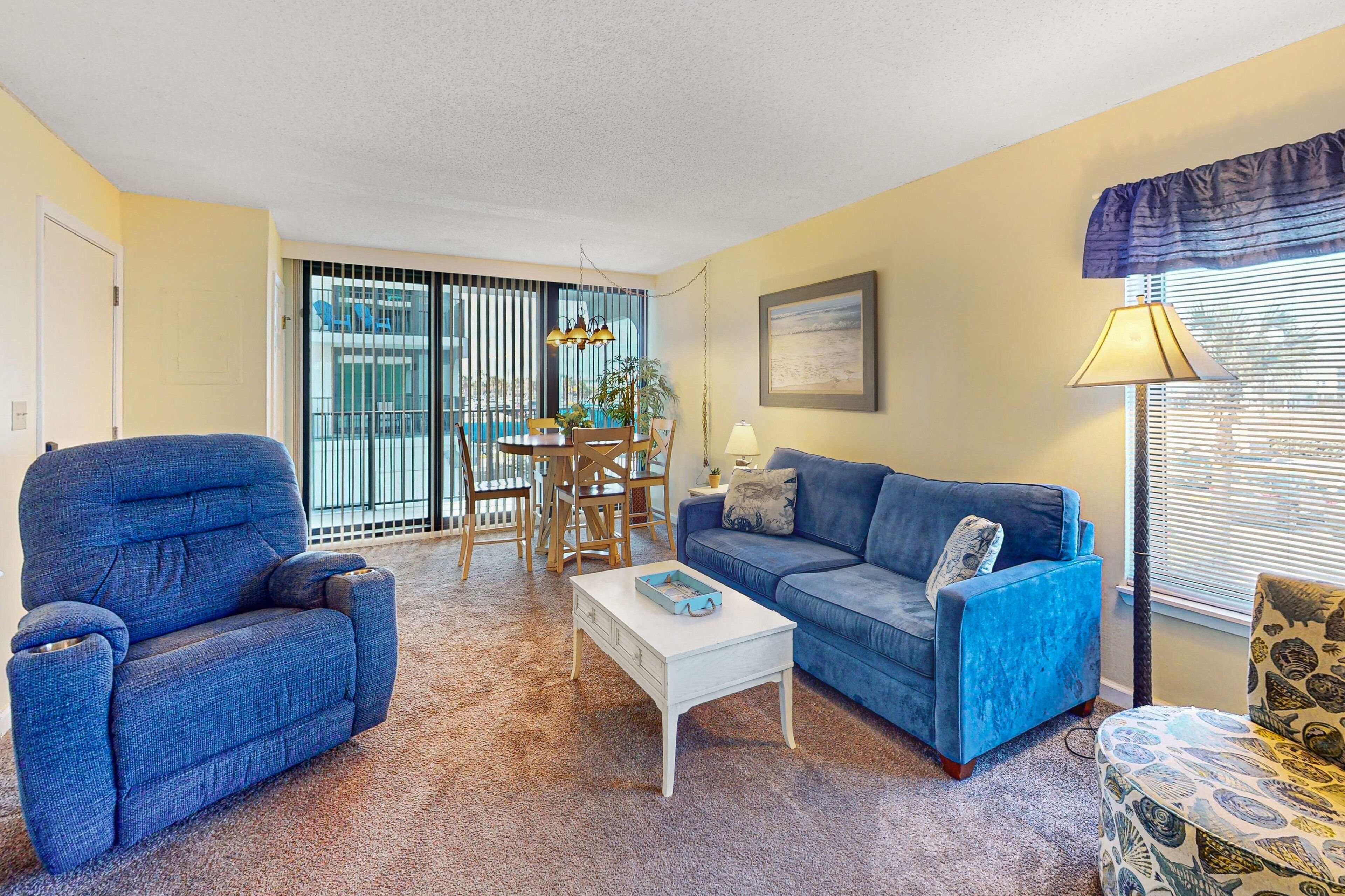 Convenient condo with balcony, beach views, pool, & central AC