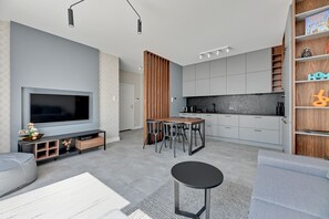 Deluxe Apartment, 1 Bedroom, Balcony, Annex Building | Living room | 55-inch LED TV with cable channels, TV