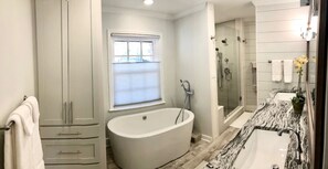 Bathtub, hair dryer, towels, soap