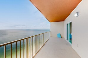 Enjoy breathtaking sea views from this balcony with a glass door leading to a spacious interior.
