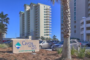 Welcome to Crystal Shores West, a beachfront property with a tropical ambiance, offering stunning views and convenient parking.