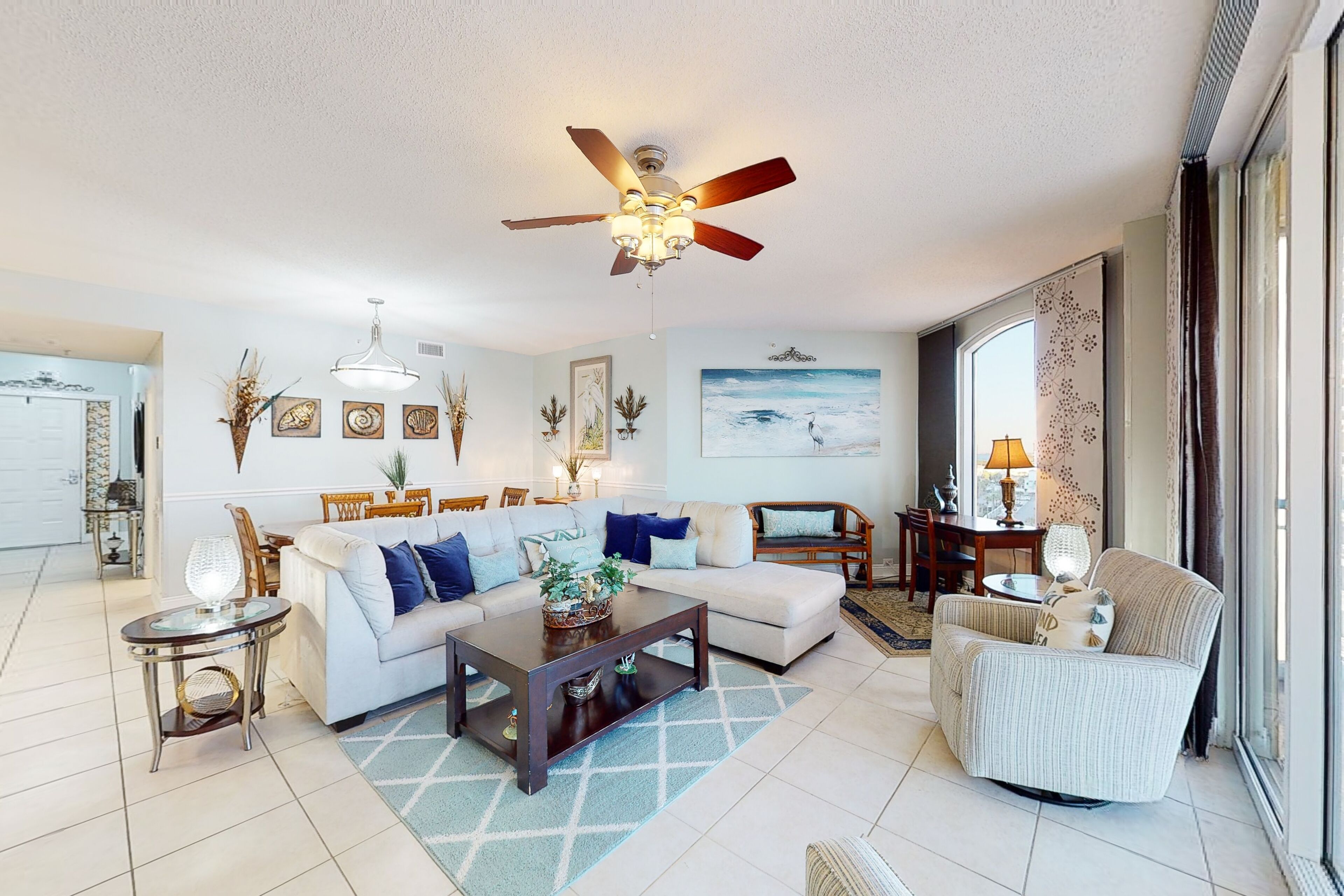 Bright beachfront condo with water views, pool, hot tub, gym, balcony & W/D