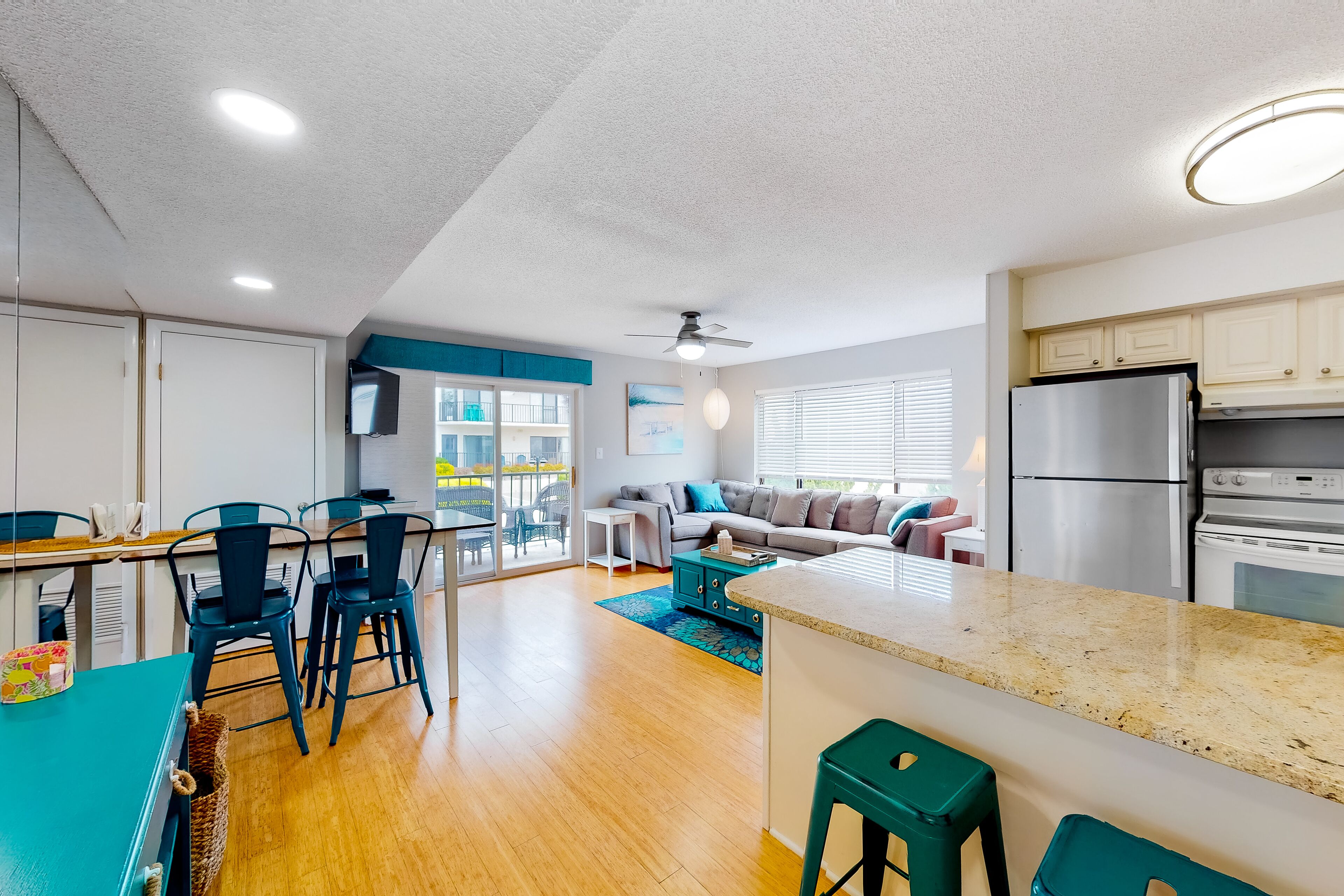 Updated corner unit condo on ocean block with balcony, pools, W/D, & central AC
