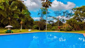 2 outdoor pools, open 6:00 AM to 10:00 PM, pool umbrellas, pool loungers