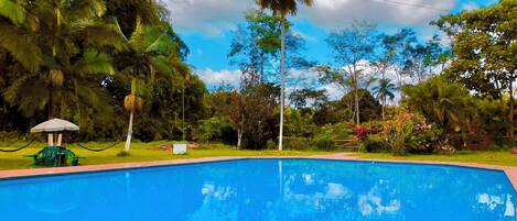 2 outdoor pools, open 6:00 AM to 10:00 PM, pool umbrellas, sun loungers