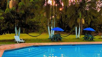 2 outdoor pools, open 6:00 AM to 10:00 PM, pool umbrellas, sun loungers