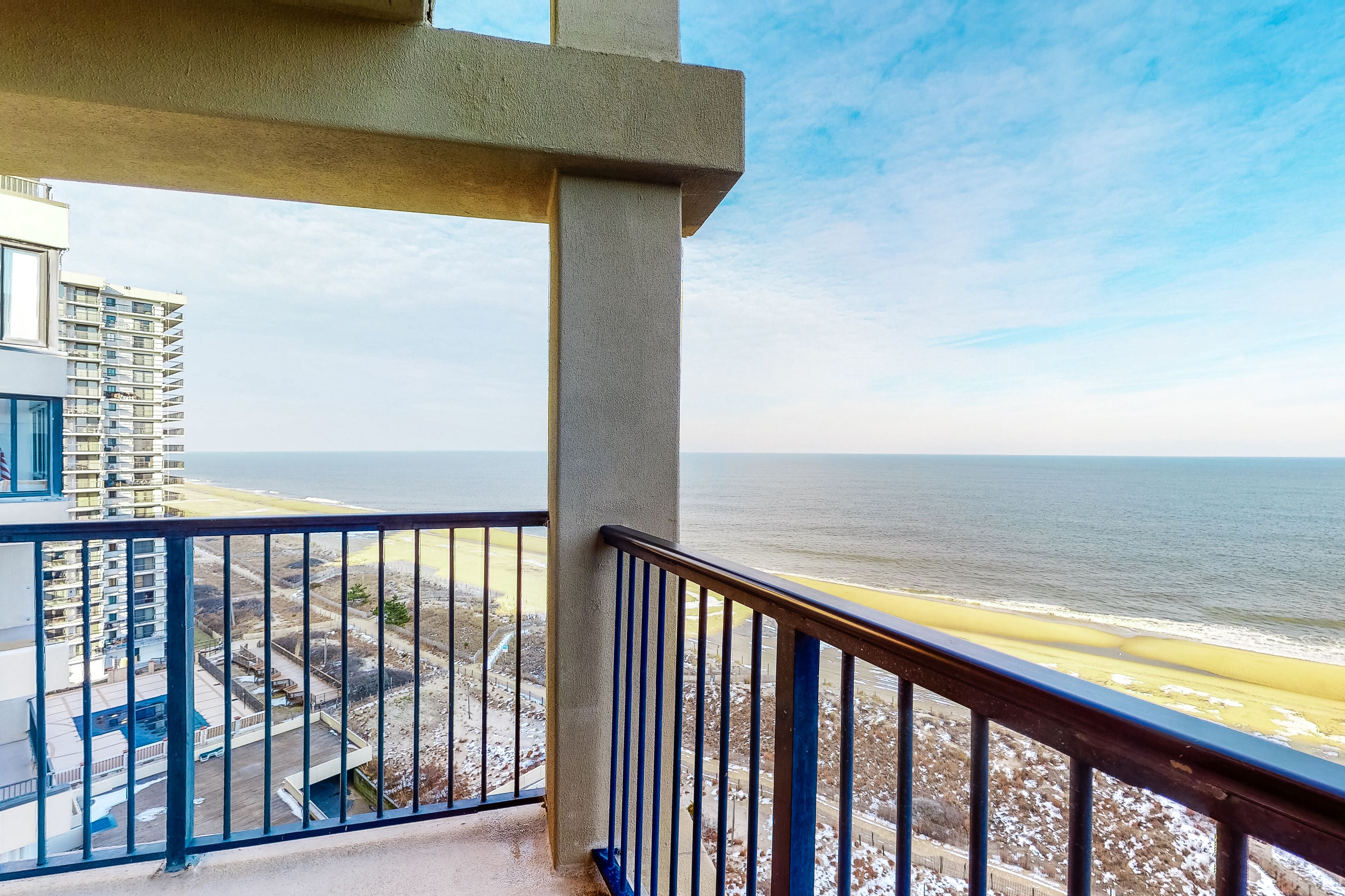 Two-story penthouse condo with spacious balcony, pool, & incredible views