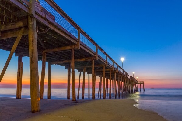 Stroll along the pier, taking in the serene atmosphere and tranquil waters.