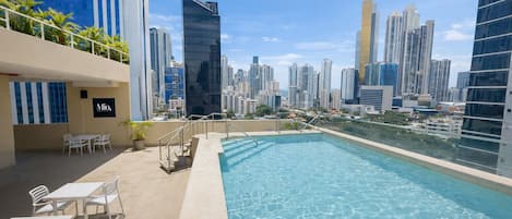 Outdoor pool, open 9:00 AM to 7:00 PM, pool loungers