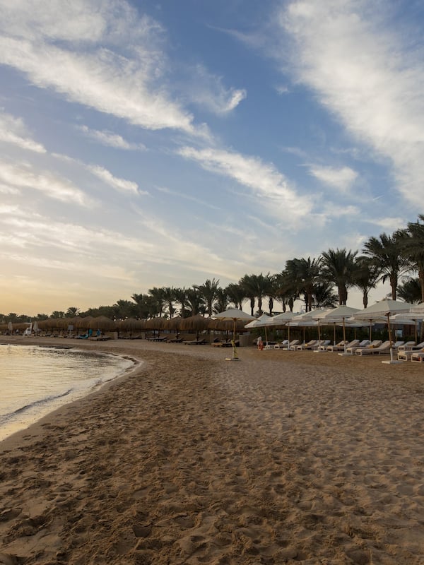 On the beach, sun-loungers, beach umbrellas, beach towels