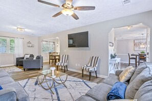 Smart TV, fireplace, books, printers