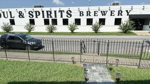 Soul & Spirits Brewery with a paved entrance and a black metal fence. - Blues Alley Downtown Memphis  (Memphis)