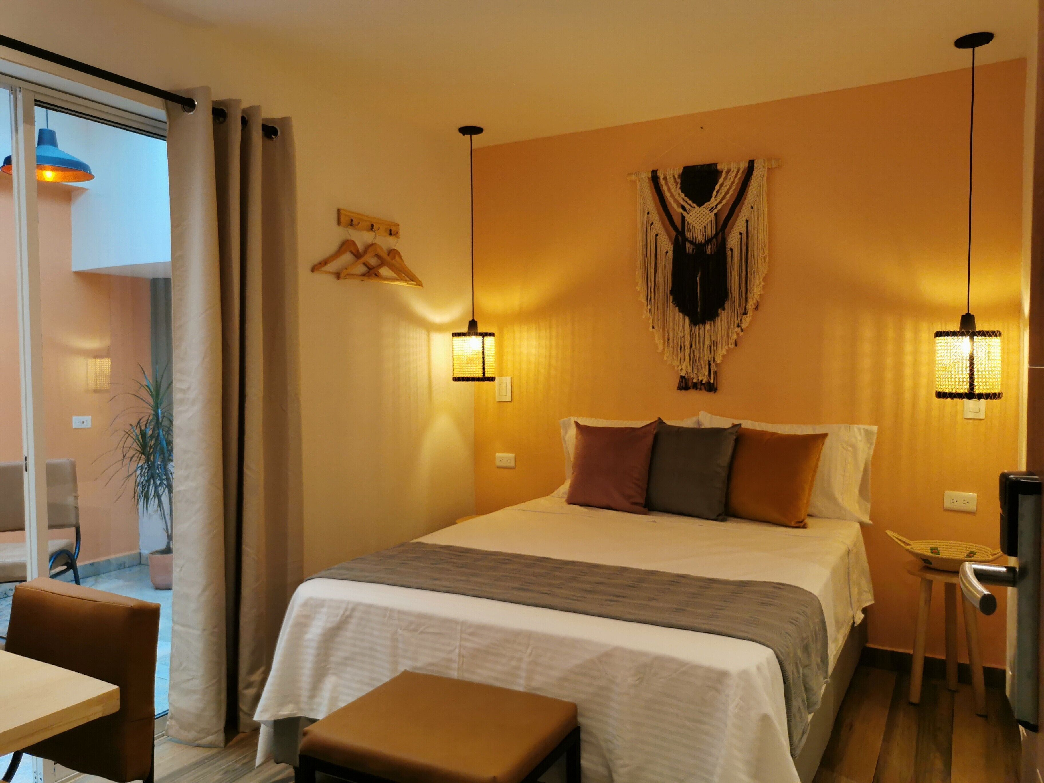 Premium bedding, desk, laptop workspace, blackout curtains