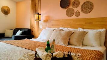 Deluxe Studio | Premium bedding, desk, laptop workspace, blackout drapes