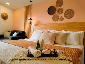 Deluxe Studio | Premium bedding, desk, laptop workspace, blackout drapes