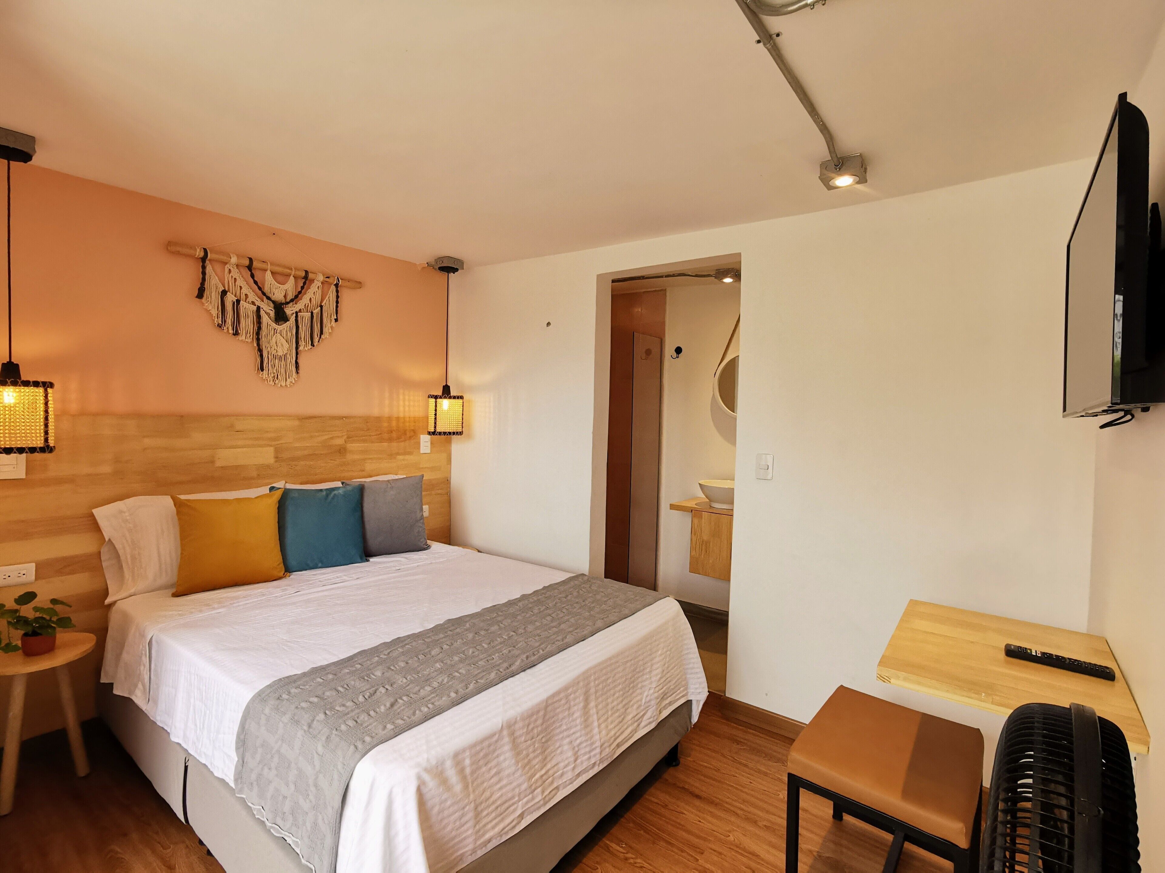 Premium bedding, desk, laptop workspace, blackout curtains