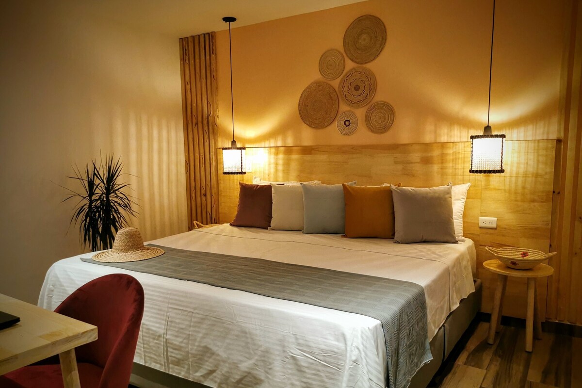 Premium bedding, desk, laptop workspace, blackout drapes
