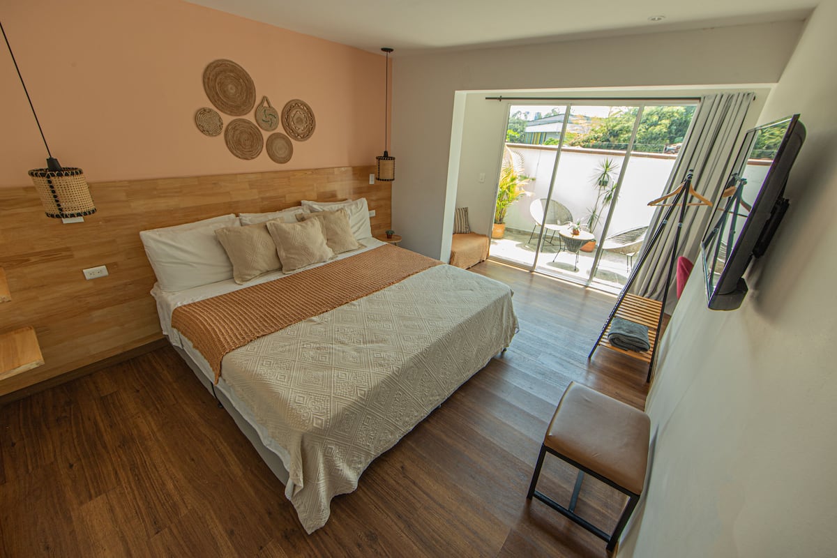 Premium bedding, desk, laptop workspace, blackout drapes