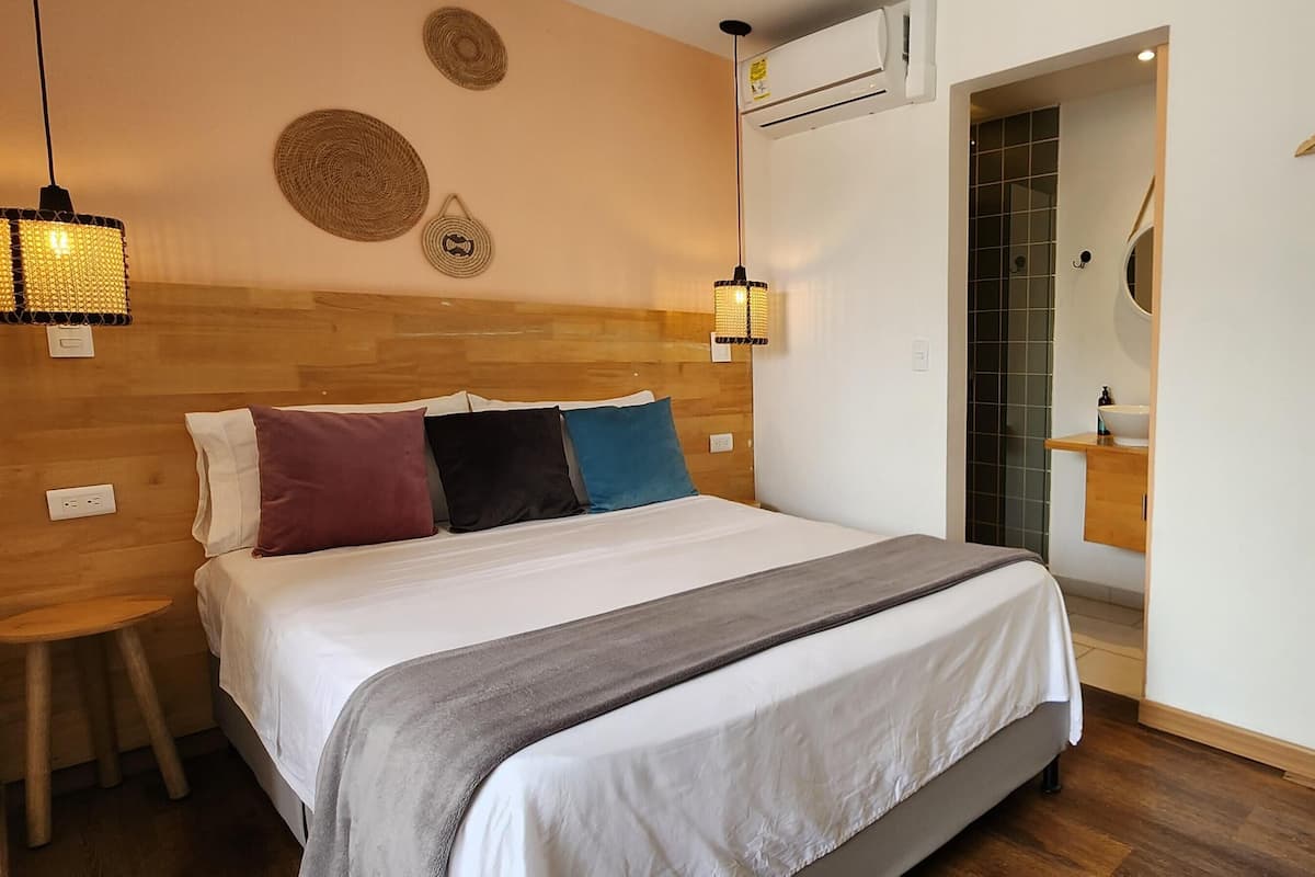 Premium bedding, desk, laptop workspace, blackout drapes