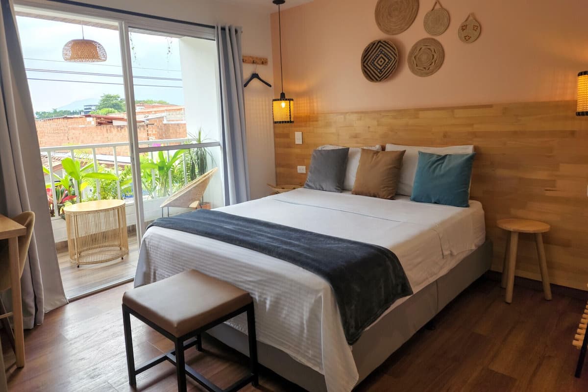 Premium bedding, desk, laptop workspace, blackout drapes