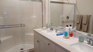 Combined shower/bathtub, hair dryer, towels, soap