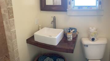 Shower, towels, soap, toilet paper