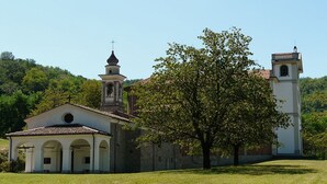 A church with a bell tower and a large tree in front. - Nonna Sandrina in Monferrato hills, Garbagna, Italy (Garbagna)