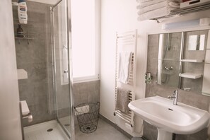 Shower, hair dryer, towels, soap