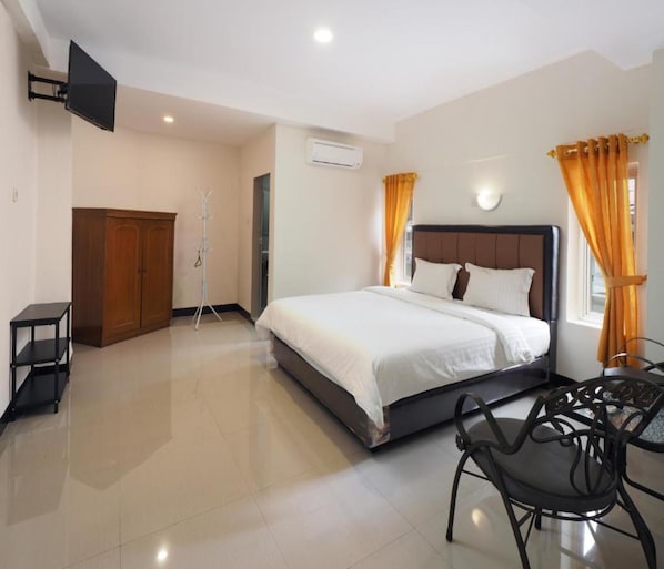Habitación Deluxe | Escritorio, wifi gratis y ropa de cama 