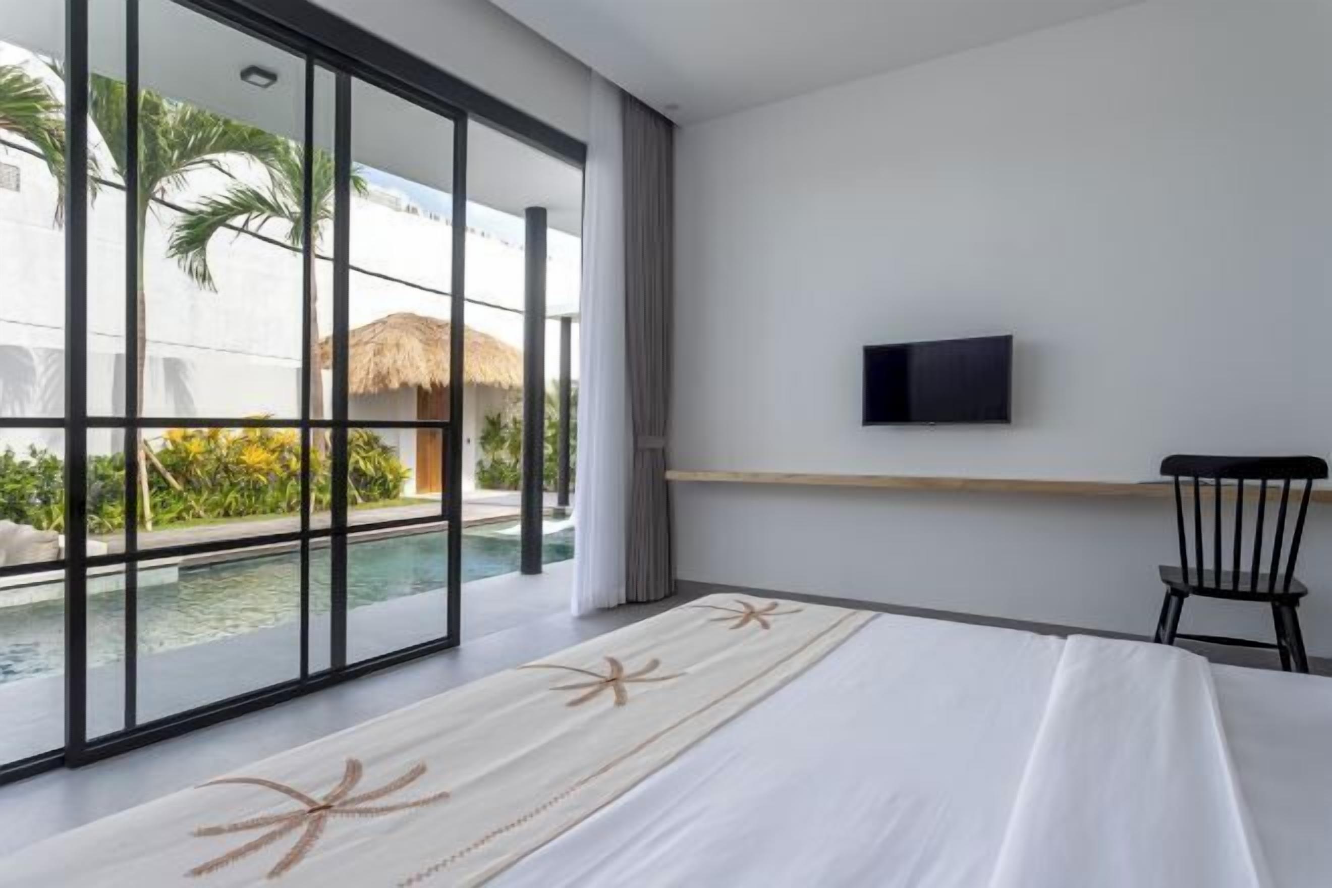 Laptop workspace, iron/ironing board, bed sheets