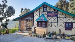 A traditional building with a sign reading "LEELA HERITAGE VILLA".
