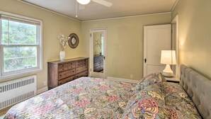 A bedroom with a bed, dresser, nightstand, and ceiling fan. - Mid-Century Bozeman Townhome ~ 1 Mi to Dtwn! (Bozeman)