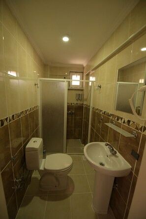 Shower, free toiletries, hair dryer, slippers