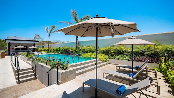 Outdoor pool, open 9:00 AM to 10:00 PM, sun loungers