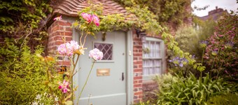 Chocolate-box pretty Pear Tree Cottage in South Downs village