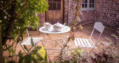 Chocolate-box pretty Pear Tree Cottage in South Downs village