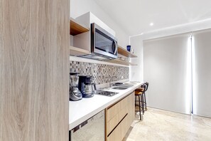 Fridge, microwave, stovetop, coffee/tea maker