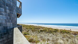 A coastal building with a view of the beach and ocean. - Ocean Front Condo Shorebirds 83 (Pajaro Dunes)