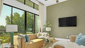 A modern living room with a sofa, a white furry throw, a TV mounted on the wall, and a large window with curtains.