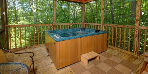 A wooden hot tub on a deck with a view of a forest. - Sweet Pickins-1 Bedroom 2 Beds 1 Bathroom (Gatlinburg)