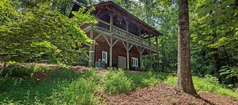 A Laurel Haven, with big porches and a log cabin feel. Fireplace.
