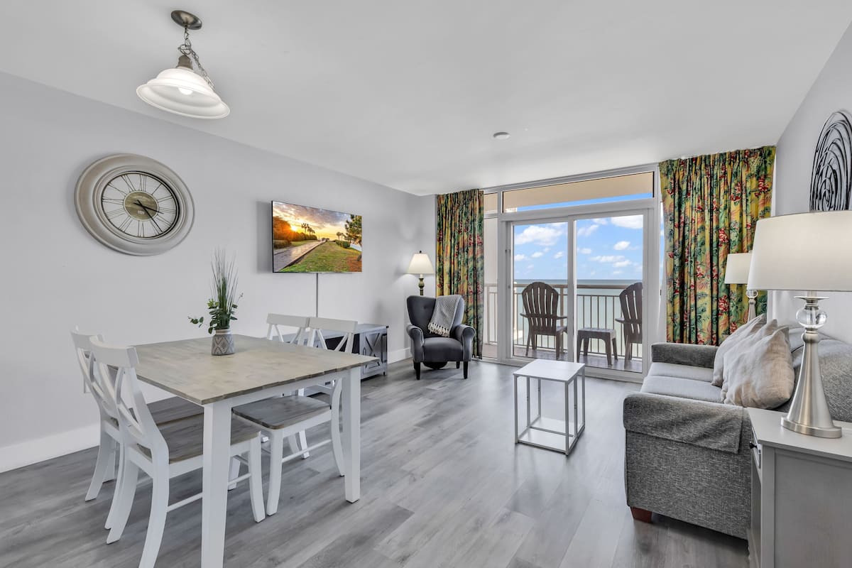 Comfort Condo, Multiple Beds, Beach View, Oceanfront | Living room | 50-inch Smart TV with digital channels