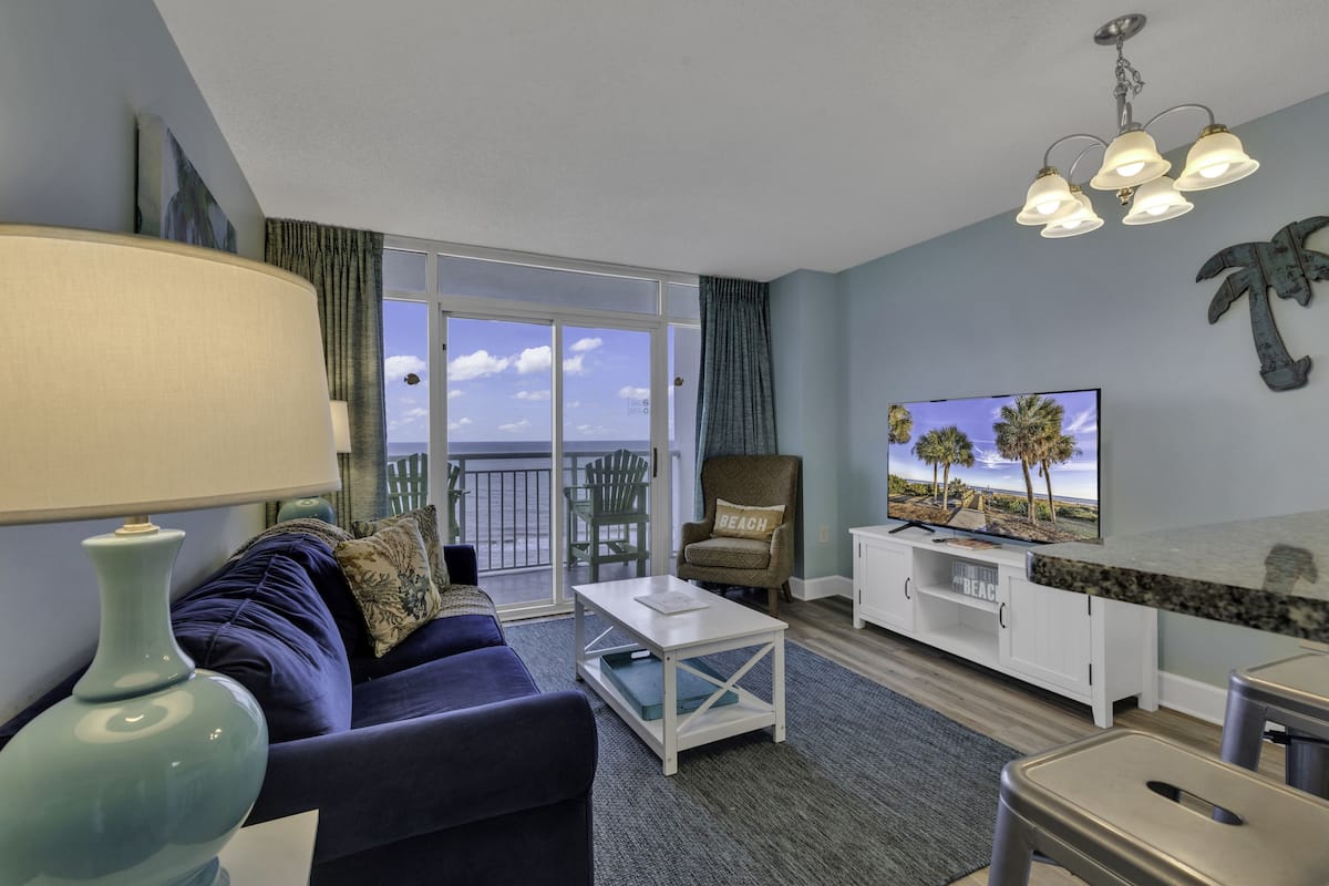 Premium Condo, Multiple Bedrooms, Balcony, Ocean View | Living room | 50-inch Smart TV with digital channels