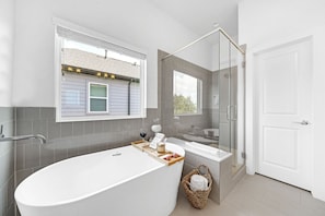 Bathtub, hair dryer, towels, soap