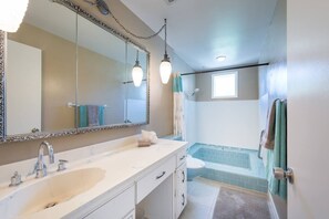 Combined shower/bathtub, hair dryer, towels, soap