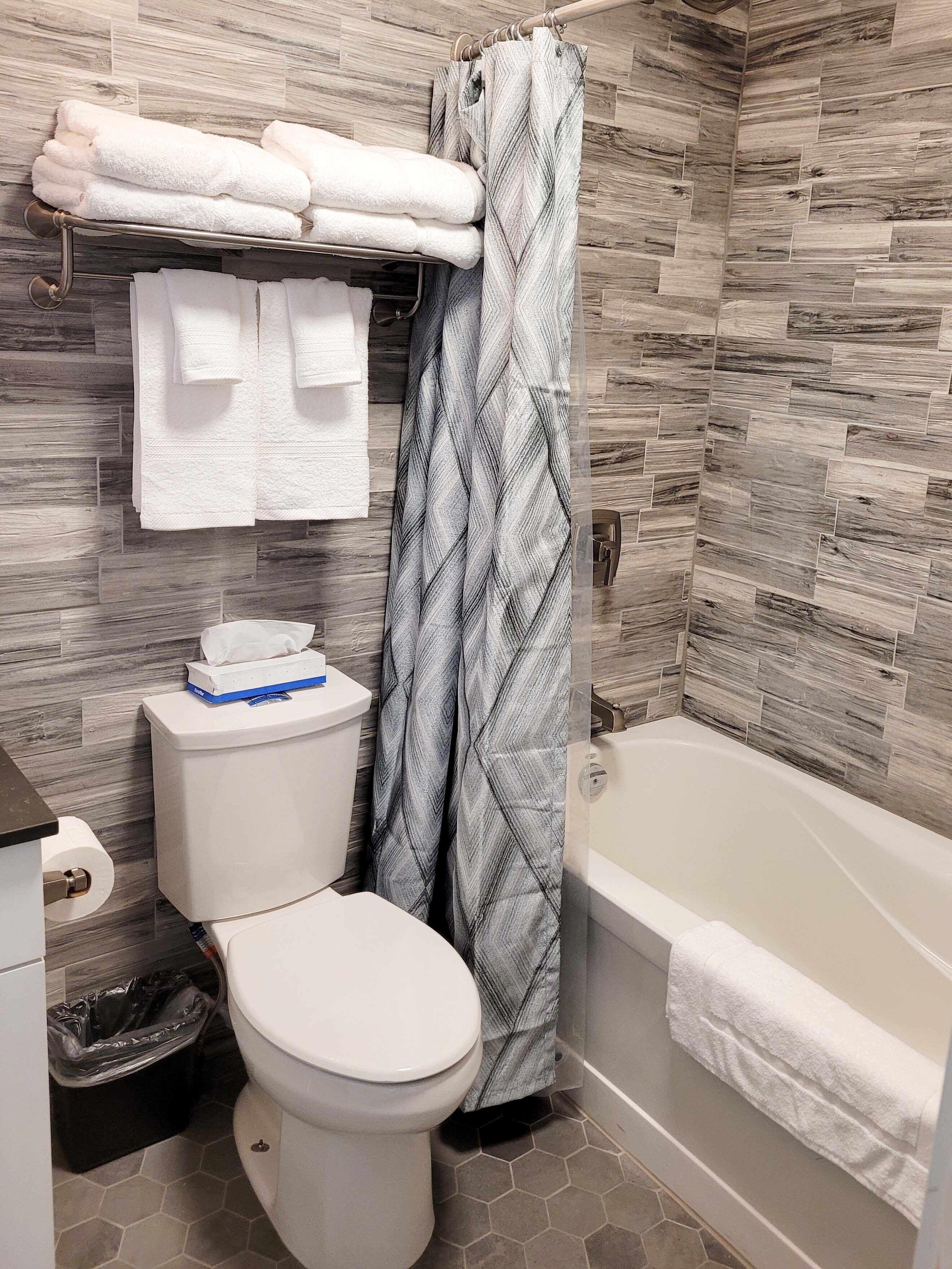 double queen | bathroom | rainfall showerhead, free toiletries, hair dryer, towels