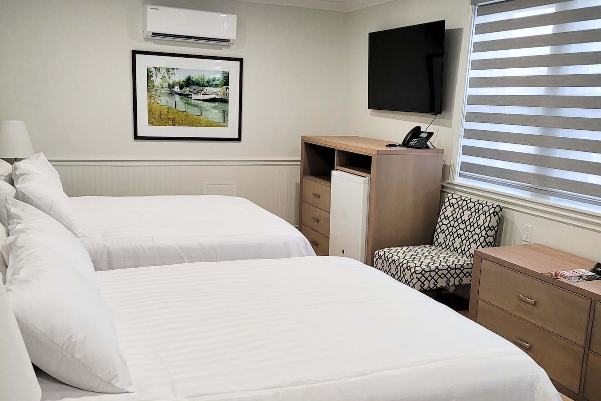 Double Queen | Luxe beddengoed, gratis wifi, beddengoed