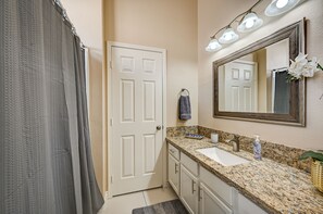 Combined shower/tub, hair dryer, towels, soap