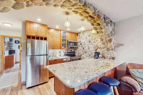 Walkable, well-appointed riverside condo with pool