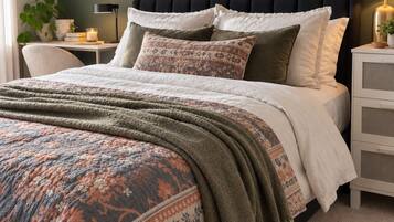 A bedroom with a bed, a nightstand, a wall-mounted shelf, and a painting.